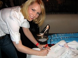 carrie keagan signing wizard jeans for charity.jpg